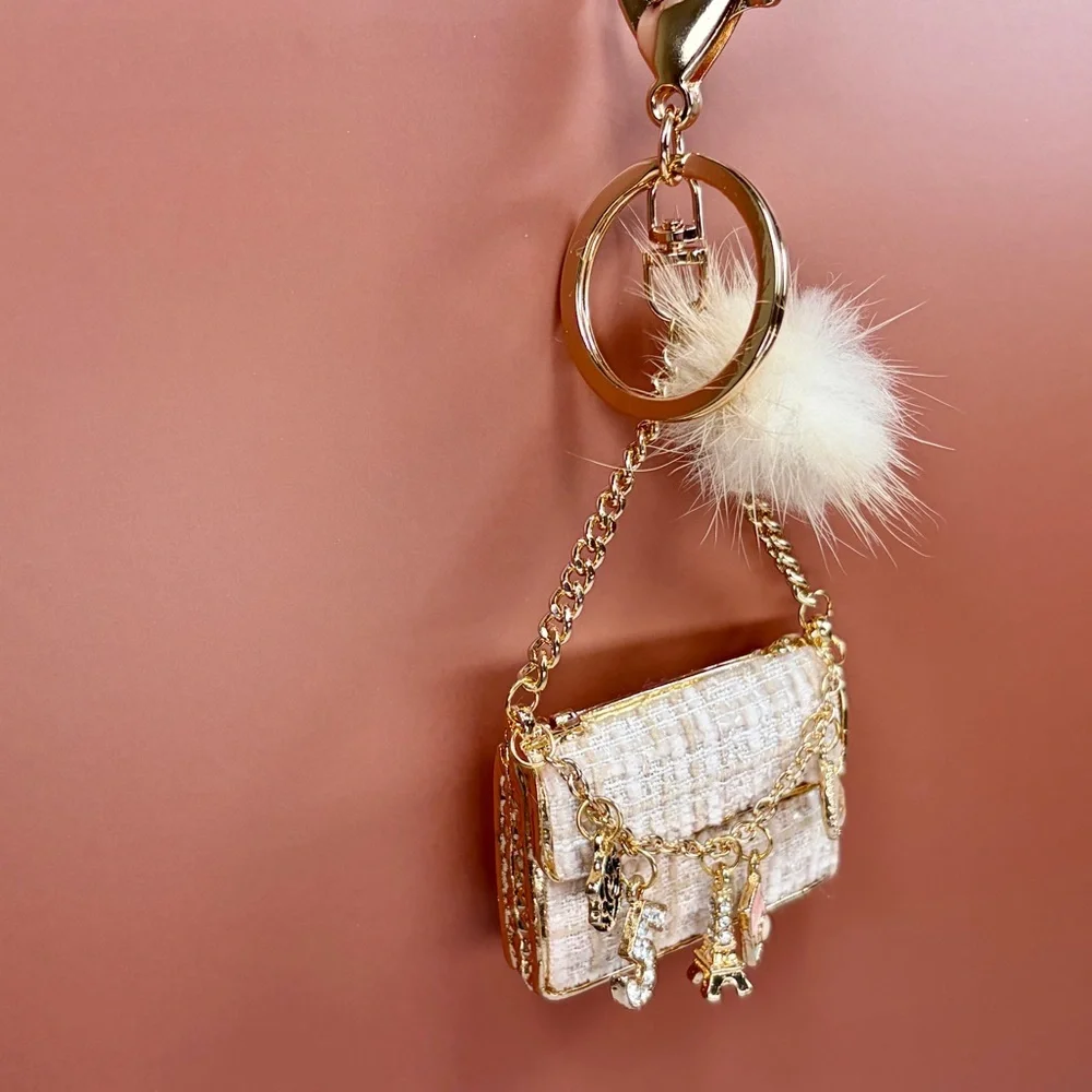 Chic Cream Tweed Mini Bag Keychain with Gold Chain and Pom